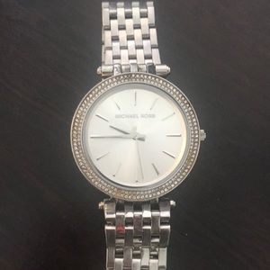 MK silver watch with diamonds around the face